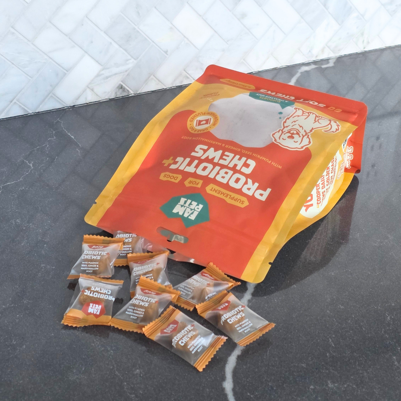 One FAM Pets individually sealed chew being opened